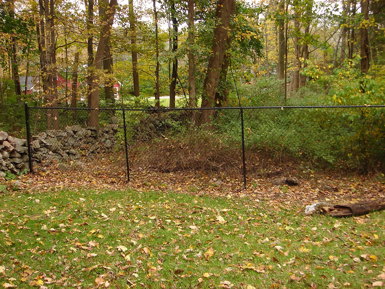 Galvanized chain link fence enclosing a commercial property