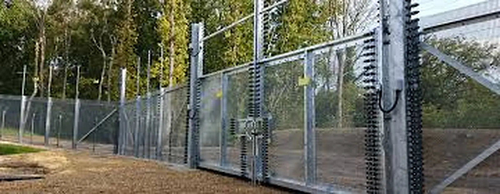 Black aluminum pool-code security fence around a Connecticut backyard pool